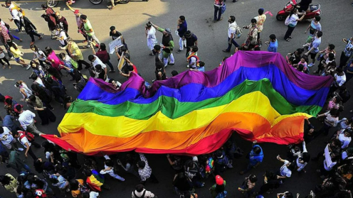 Parade with large rainbow flag
